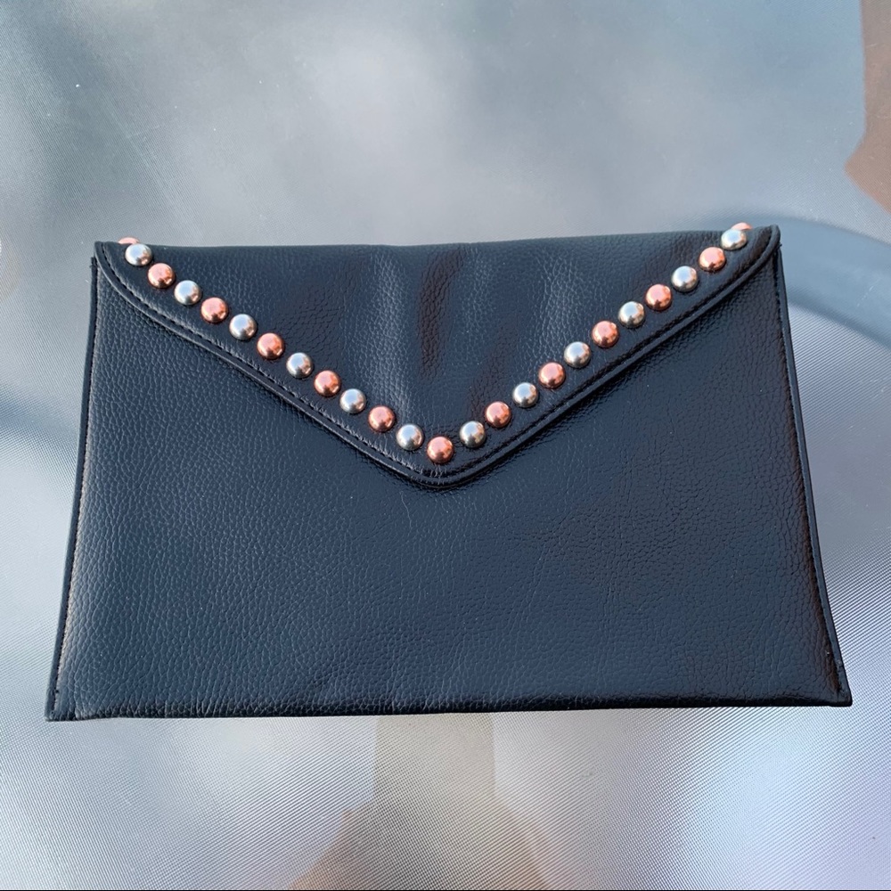 NWT Below belt beautiful soft faux leather clutch